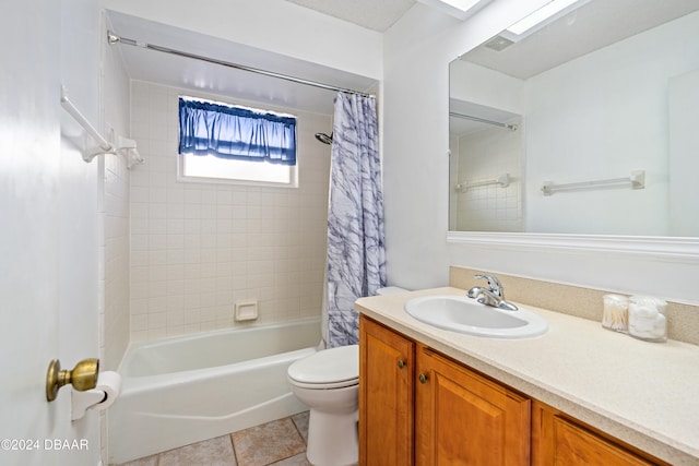 full bathroom featuring toilet, vanity, shower / bath combination with curtain, and tile patterned floors