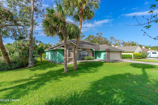 single story home with a garage and a front yard