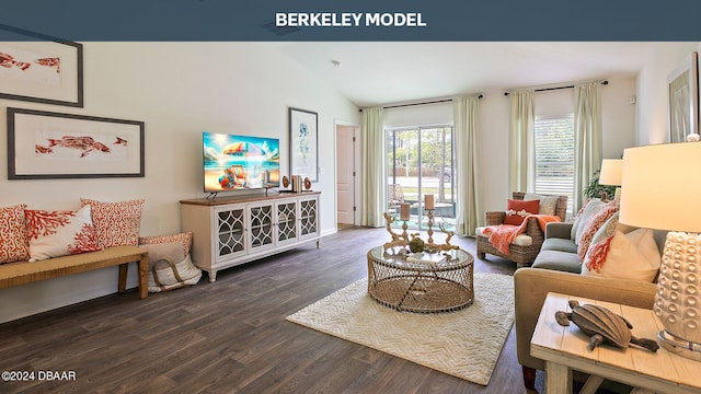 living room featuring dark hardwood / wood-style flooring and vaulted ceiling