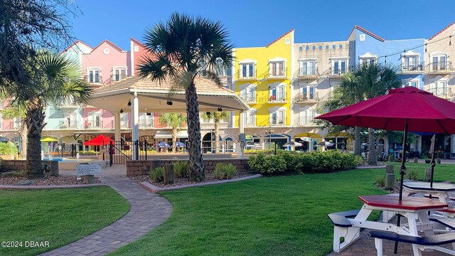 view of community featuring a yard and a gazebo