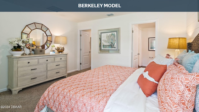 bedroom featuring connected bathroom and carpet flooring