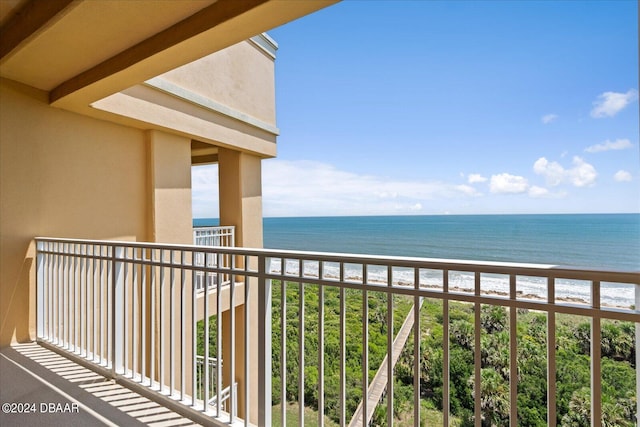 balcony with a view of the beach and a water view