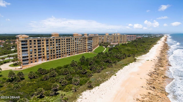 birds eye view of property featuring a view of the beach and a water view