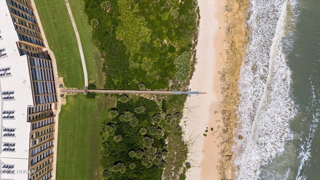 birds eye view of property with a water view and a view of the beach