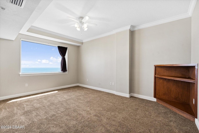 carpeted empty room with ornamental molding, a textured ceiling, and ceiling fan