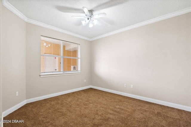 carpeted empty room featuring ceiling fan, a textured ceiling, and crown molding