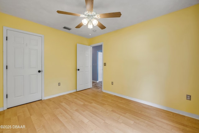 20 Potters Ln, Palm Coast, FL 32164 - unfurnished bedroom with baseboards, light wood-style flooring, and a ceiling fan