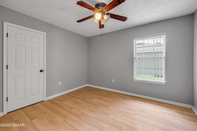 20 Potters Ln, Palm Coast, FL 32164 - unfurnished room featuring a ceiling fan, wood finished floors, and baseboards