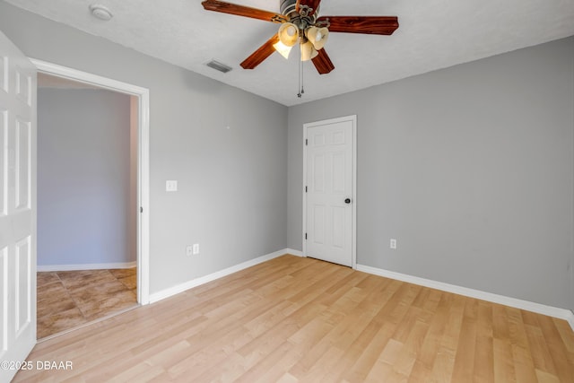 20 Potters Ln, Palm Coast, FL 32164 - empty room featuring a ceiling fan, a smoke detector, baseboards, and light wood-style floors