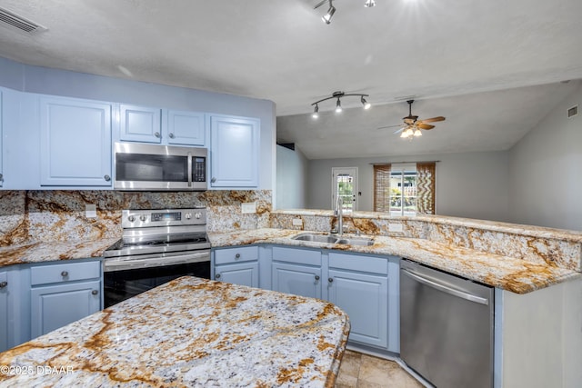 20 Potters Ln, Palm Coast, FL 32164 - kitchen featuring appliances with stainless steel finishes, a sink, ceiling fan, and light stone counters