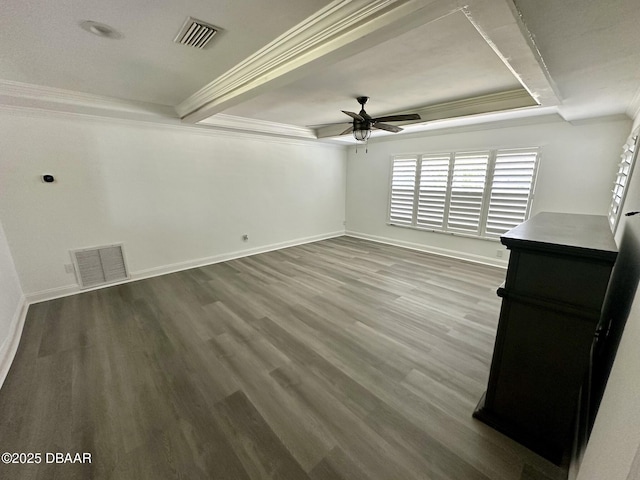 spare room with crown molding, a ceiling fan, baseboards, and visible vents