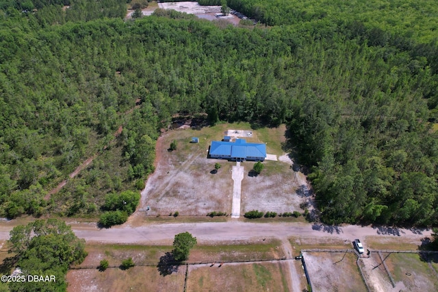 aerial view featuring a forest view