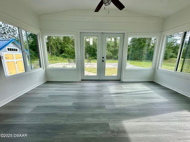 unfurnished sunroom featuring a healthy amount of sunlight, french doors, and lofted ceiling