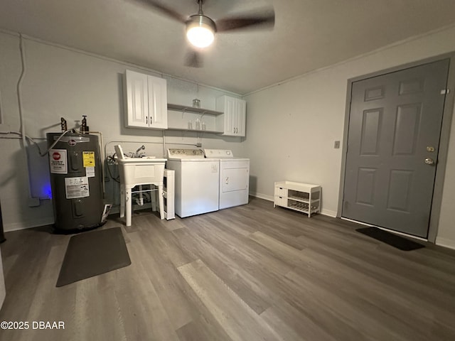 143 Pinecrest Cir, San Mateo, FL 32187 - laundry area with washing machine and clothes dryer, cabinet space, electric water heater, ceiling fan, and wood finished floors