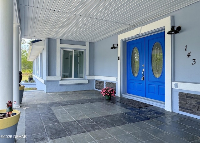 property entrance with stucco siding