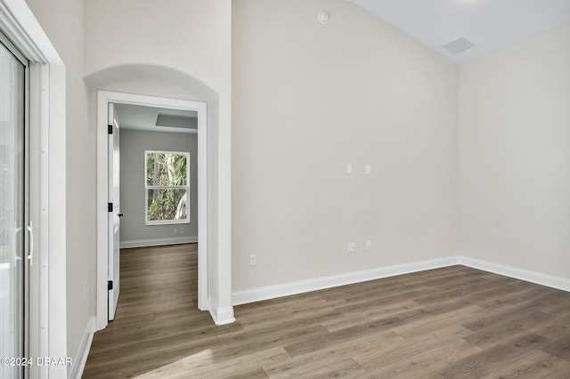 spare room featuring wood-type flooring