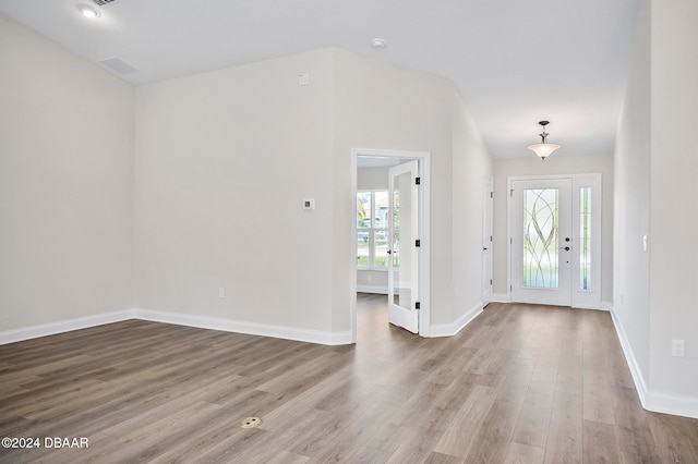 entrance foyer with hardwood / wood-style floors