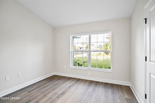 unfurnished room featuring hardwood / wood-style flooring