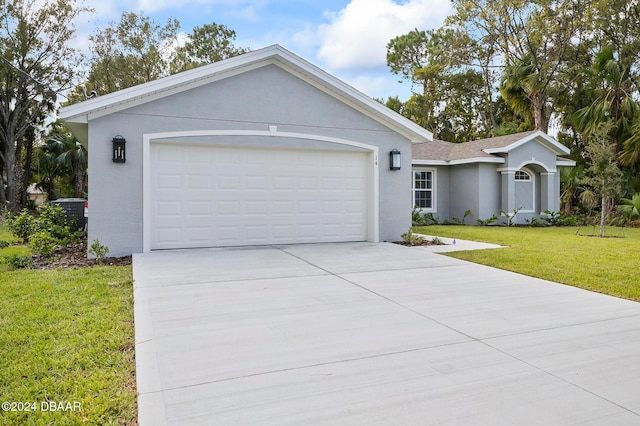 ranch-style house with a garage and a front lawn