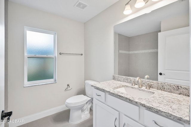 bathroom with toilet and vanity