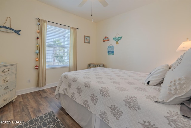 bedroom with ceiling fan and dark hardwood / wood-style floors