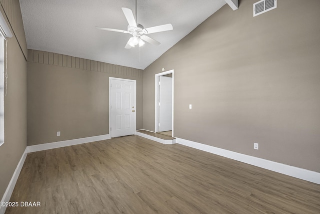 unfurnished room featuring ceiling fan, high vaulted ceiling, and light hardwood / wood-style floors