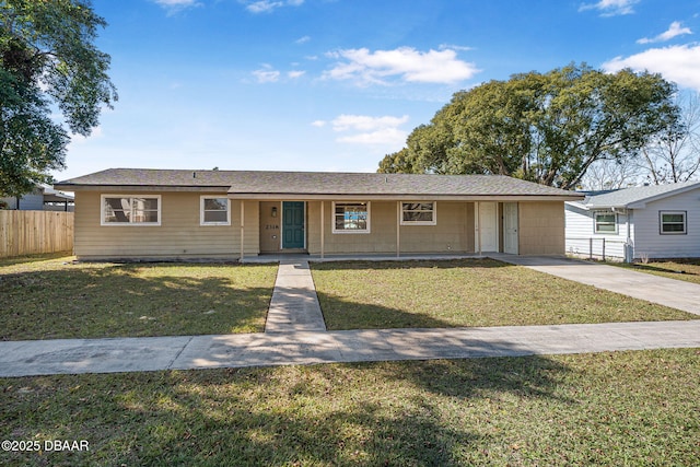 ranch-style home with a front lawn