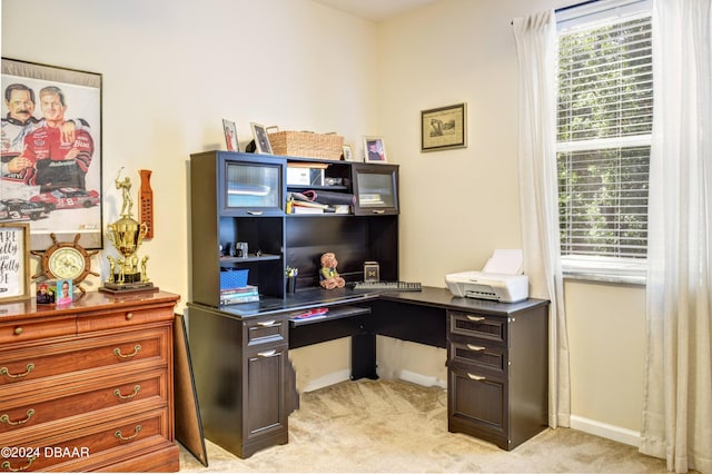 home office featuring light colored carpet and baseboards