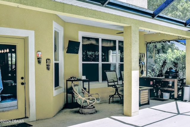 view of patio / terrace featuring a lanai