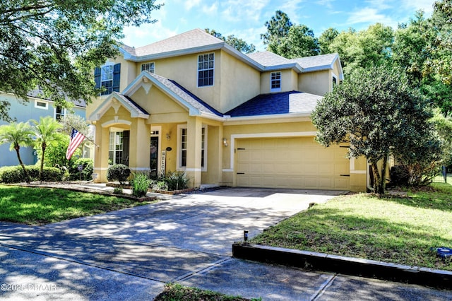 traditional home with a shingled roof, driveway, an attached garage, and stucco siding