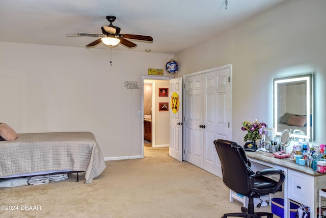 bedroom with a closet, light carpet, and baseboards