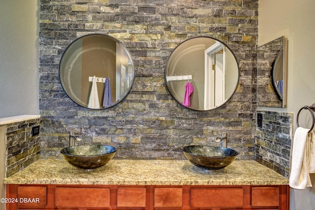 bathroom with double vanity and a sink