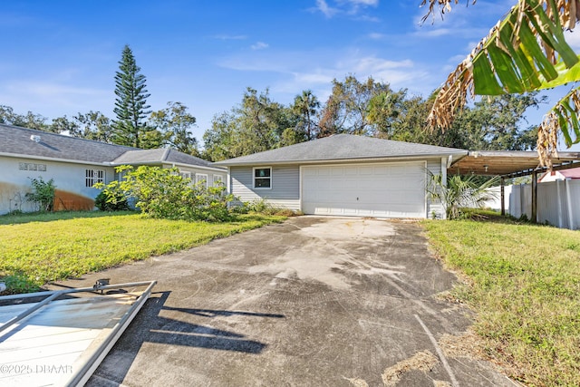 ranch-style home featuring a front yard, a garage, and a carport