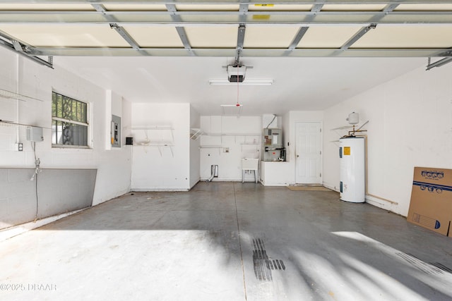 garage featuring water heater, electric panel, and a garage door opener