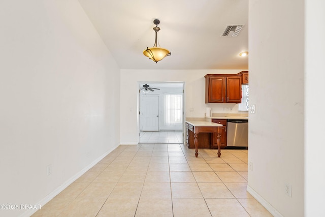 kitchen featuring hanging light fixtures, ceiling fan, light tile patterned flooring, and stainless steel dishwasher