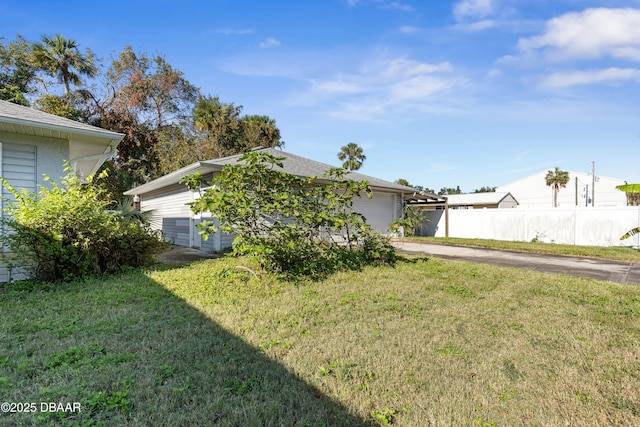 exterior space featuring a front yard and a garage