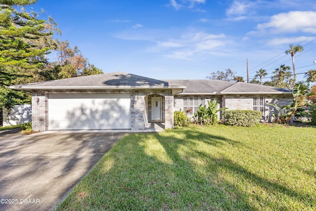 single story home with a front lawn and a garage