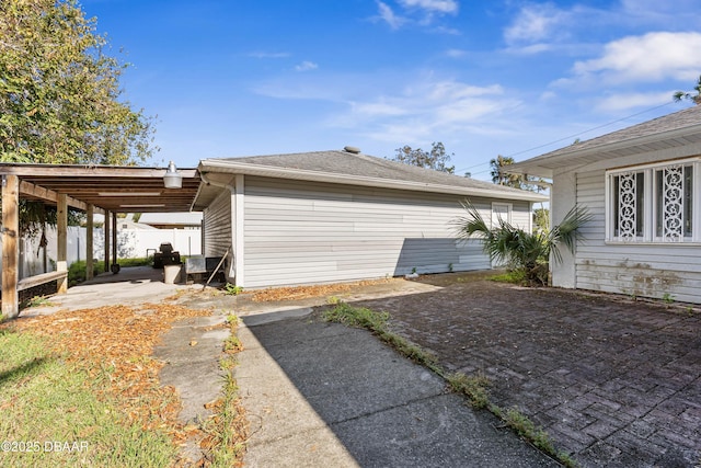 view of home's exterior featuring a carport