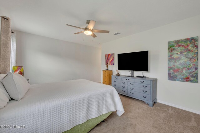 350 Sunset Point Dr, Ormond Beach, FL 32174 - bedroom featuring light carpet, baseboards, and a ceiling fan