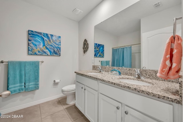 bathroom with toilet, vanity, tile patterned flooring, and curtained shower