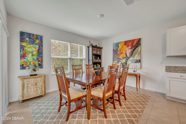 dining area with light tile patterned floors