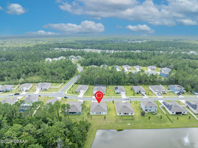 350 Sunset Point Dr, Ormond Beach, FL 32174 - aerial overview of property's location with a heavily wooded area, a large body of water, and nearby suburban area