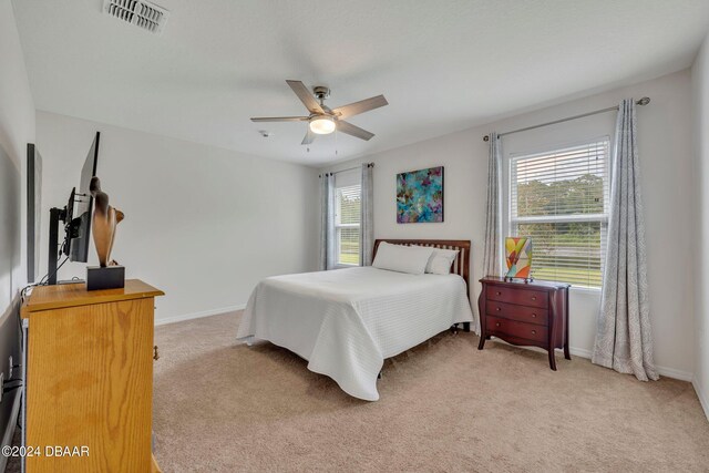 350 Sunset Point Dr, Ormond Beach, FL 32174 - bedroom featuring light colored carpet, baseboards, and a ceiling fan