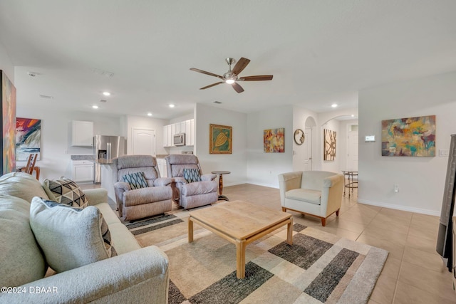 tiled living room featuring ceiling fan