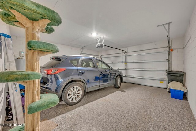 350 Sunset Point Dr, Ormond Beach, FL 32174 - garage with a garage door opener