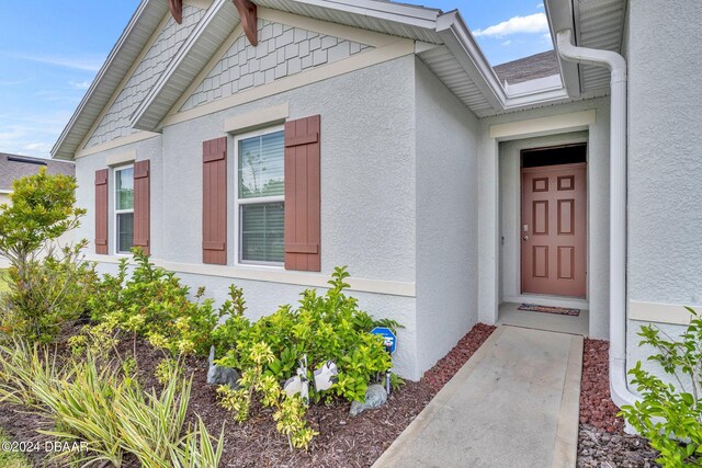 350 Sunset Point Dr, Ormond Beach, FL 32174 - entrance to property featuring stucco siding
