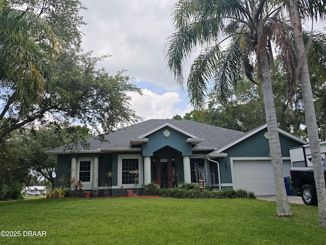 474 Carnival Ter, Sebastian, FL 32958 - view of front facade featuring stucco siding, a front yard, a garage, and roof with shingles