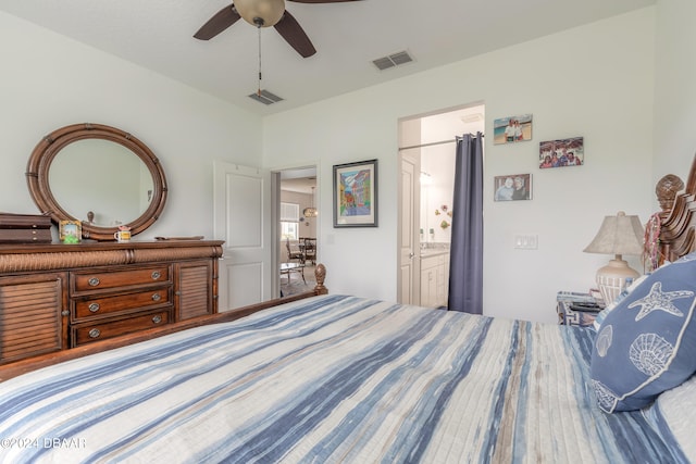 bedroom featuring ceiling fan and ensuite bath