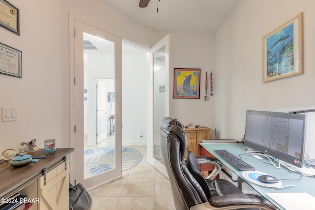 office space featuring light tile patterned floors and ceiling fan