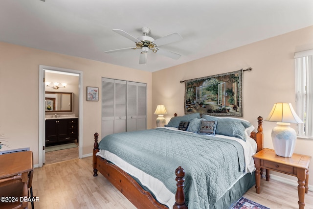 bedroom featuring ceiling fan, connected bathroom, a closet, and light hardwood / wood-style flooring